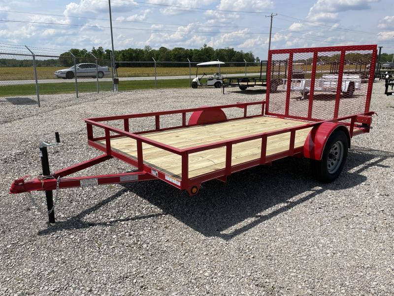 Red Open Utility Trailer With a Wooden Bed and Side Rails Parked on a Gravel Lot