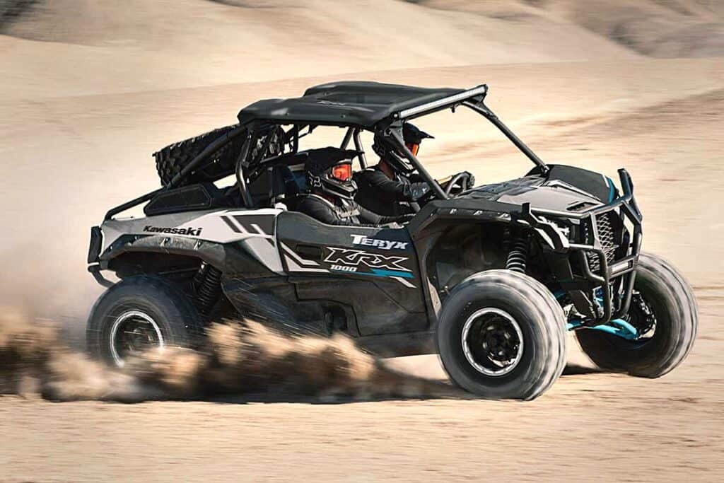 Kawasaki Teryx KRX 1000 UTV Speeding Across a Sand Dune