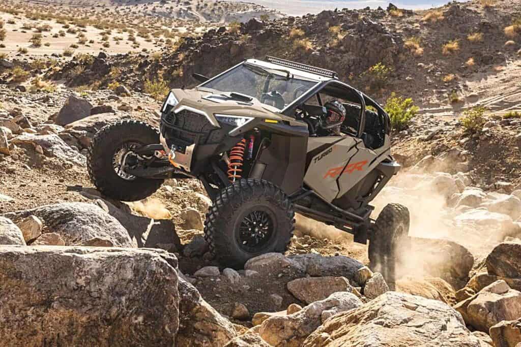 Polaris RZR Turbo R Ultimate Skillfully Climbing Over a Rugged, Rocky Terrain