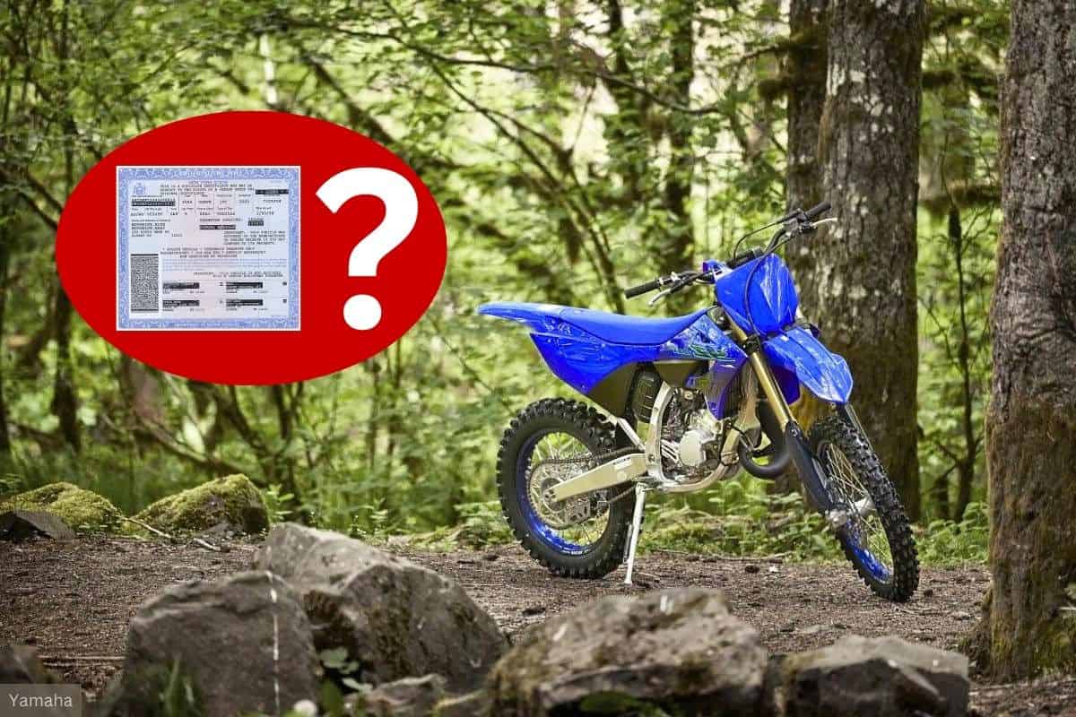 A blue dirt bike parked on a forest trail with a question mark next to an image of a title document.